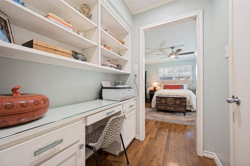 4521 Nashwood Lane, Dallas, TX 75244 Built-in shelving, integrated desk, and wood flooring