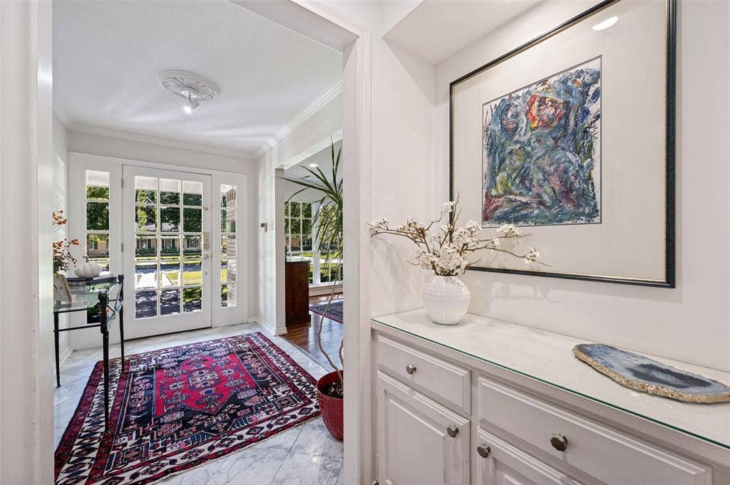 4521 Nashwood Lane, Dallas, TX 75244 Entryway featuring glass-paneled front door with sidelights, and a transom window