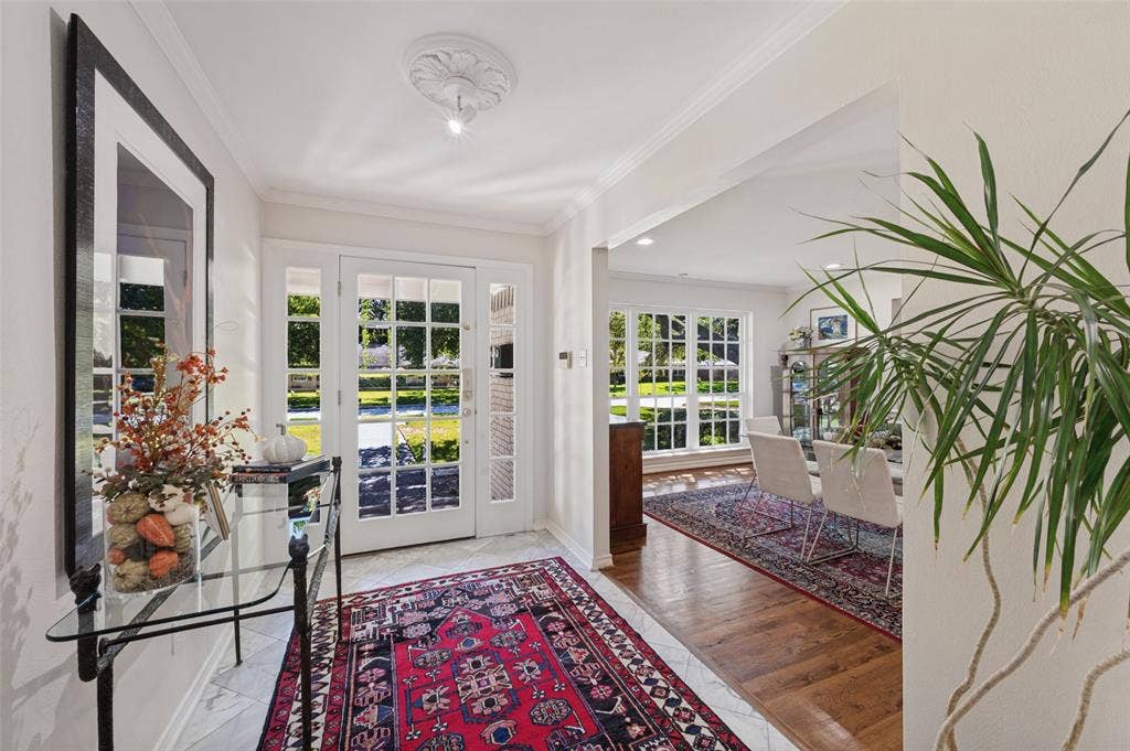 4521 Nashwood Lane, Dallas, TX 75244 Entryway with a French door, transom windows, and crown molding