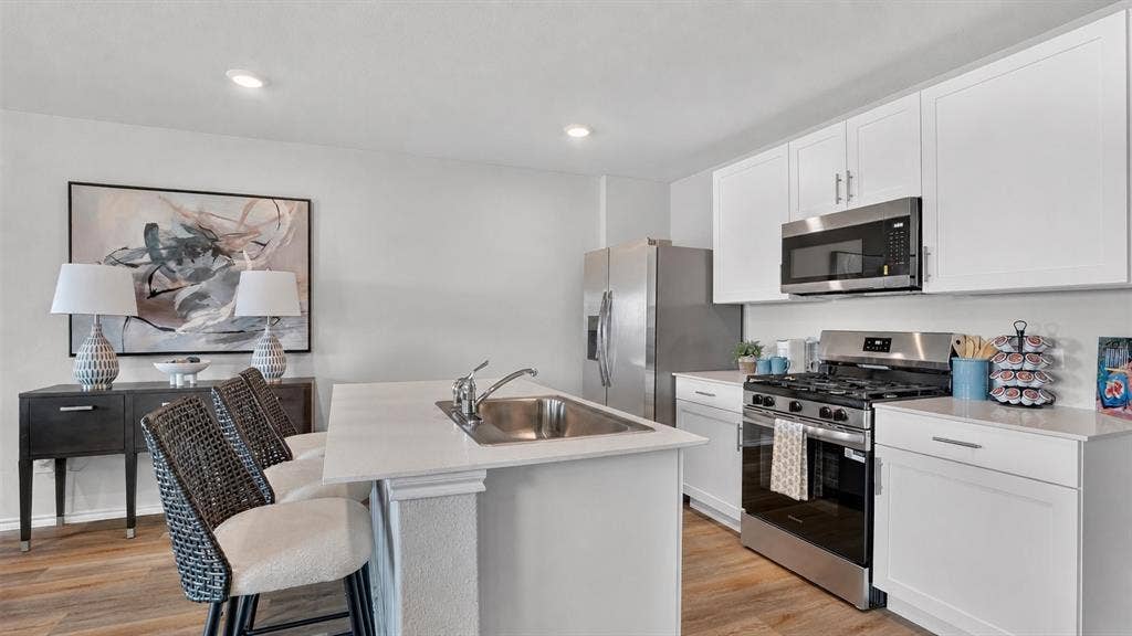 Kitchen - All Home and community information, including pricing, included features, terms, availability and amenities, are subject to change at any time without notice or obligation. All Drawings, pictures, photographs, video, square footages, floor plans, elevations, features, colors and sizes are approximate for illustration purposes only and will vary from the homes as built.