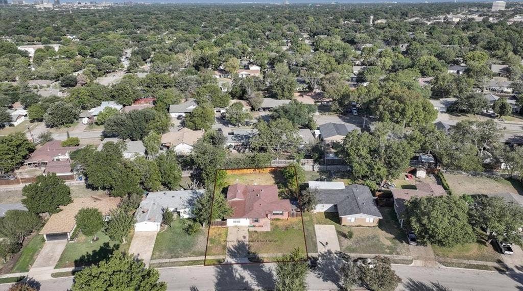 13521 Flagstone Lane, Dallas, TX 75240 Single-story residence with a red shingle roof and a front-facing driveway
