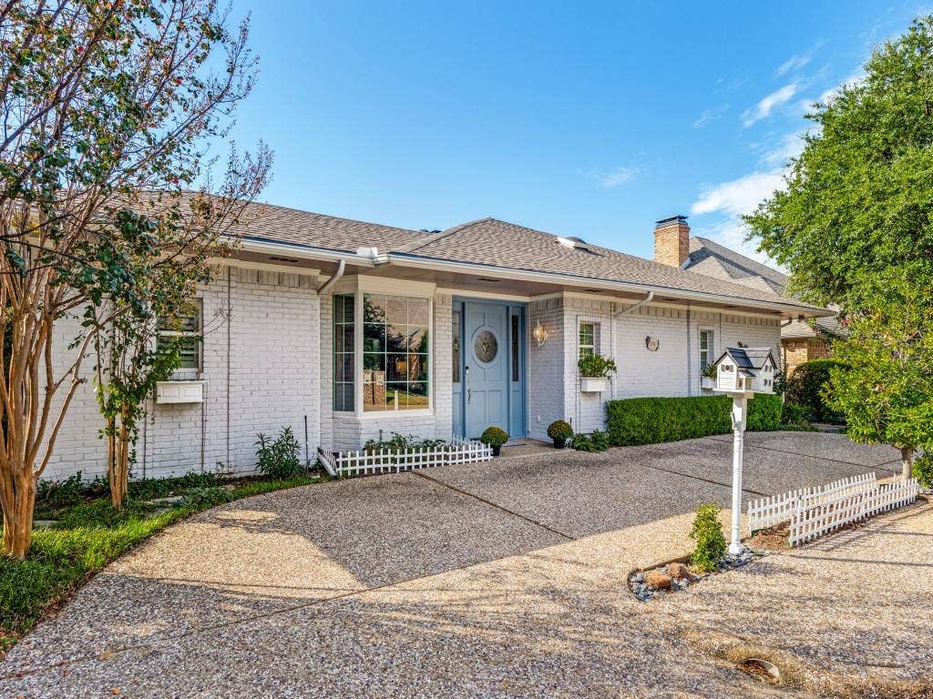 5718 Trail Meadow Drive, Dallas, TX 75230 Inviting curb appeal with circular drive and manicured landscaping