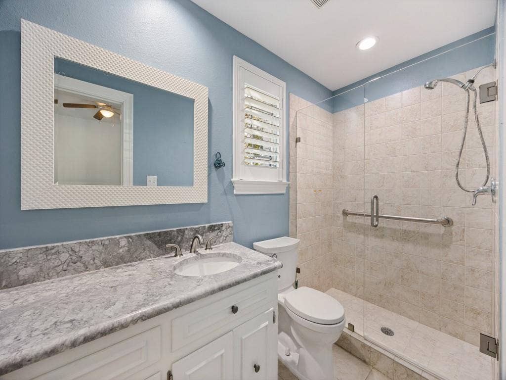 5718 Trail Meadow Drive, Dallas, TX 75230 Full bath with walk-in shower and marble vanity