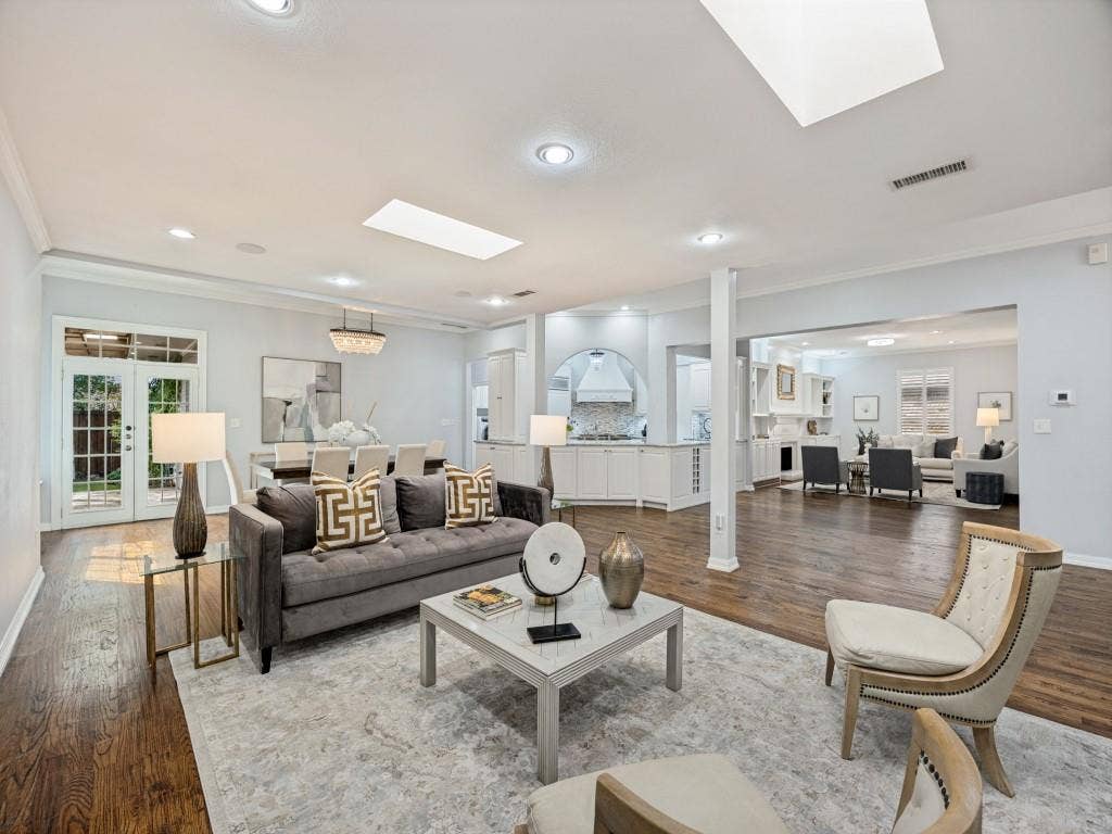 5718 Trail Meadow Drive, Dallas, TX 75230 Open-concept living, dining and kitchen with skylights and hardwoods throughout