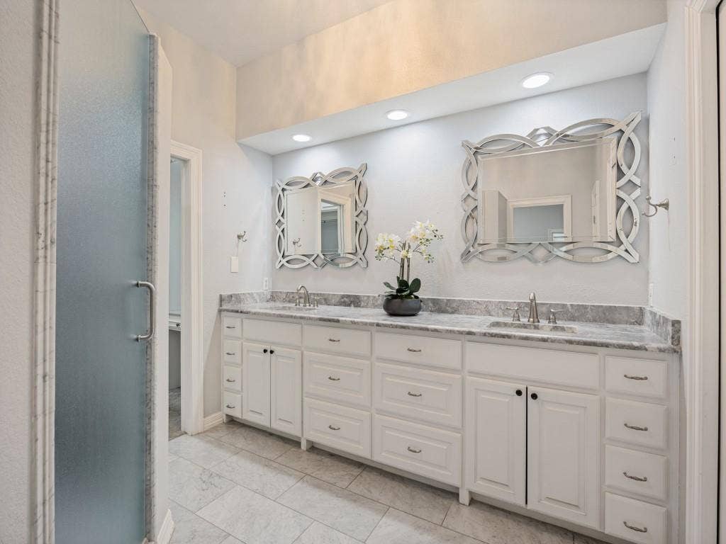 5718 Trail Meadow Drive, Dallas, TX 75230 Primary bath with double vanity and marble countertops