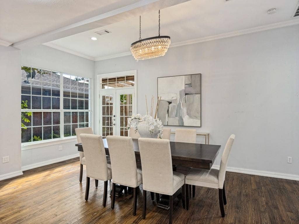 5718 Trail Meadow Drive, Dallas, TX 75230 Dining area with statement chandelier and large picture window