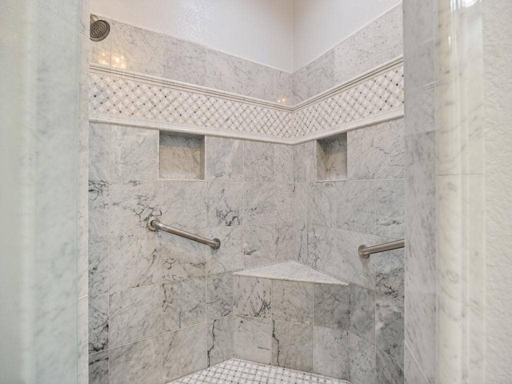 5718 Trail Meadow Drive, Dallas, TX 75230 Marble walk-in shower with bench, niches and grab bars