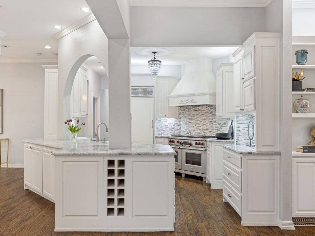 5718 Trail Meadow Drive, Dallas, TX 75230 Kitchen peninsula with abundant storage opens to the den