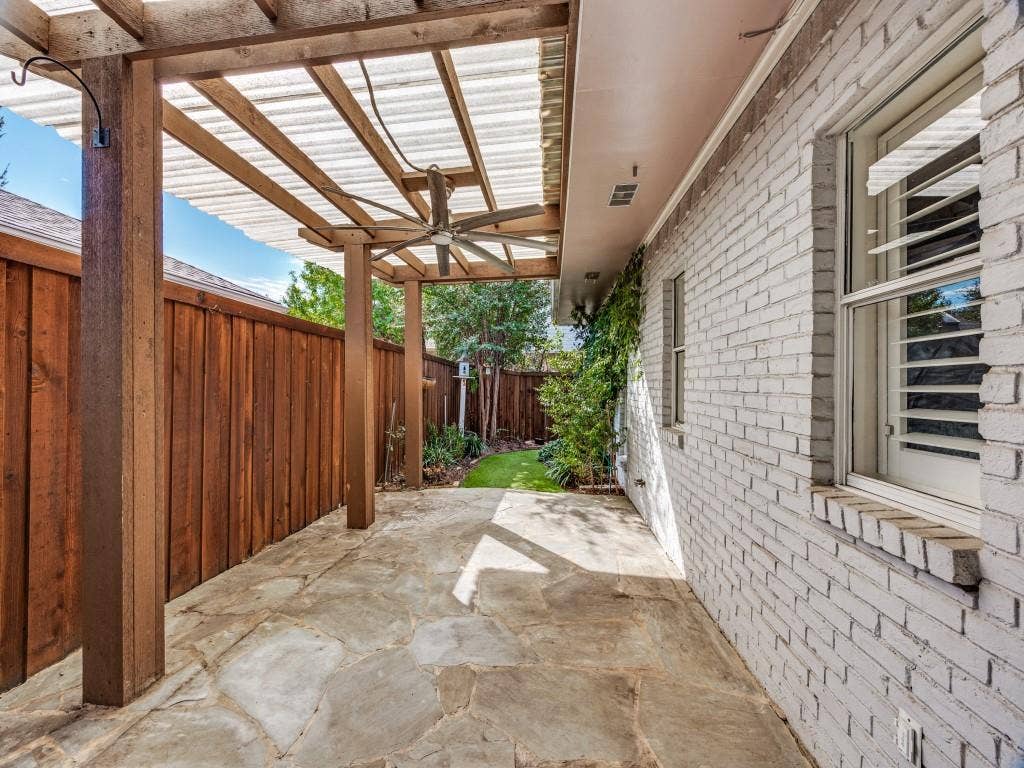 5718 Trail Meadow Drive, Dallas, TX 75230 Shaded flagstone patio under the pergola