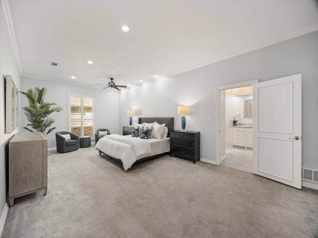 5718 Trail Meadow Drive, Dallas, TX 75230 Spacious primary bedroom with crown molding and plantation shutters