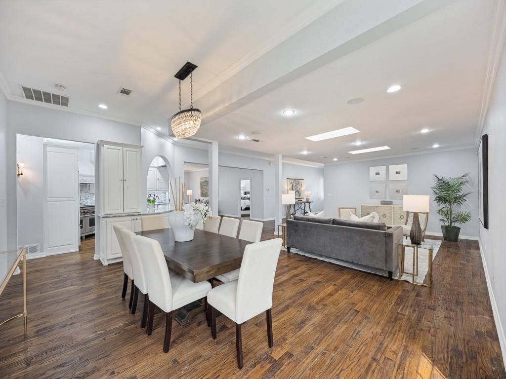 5718 Trail Meadow Drive, Dallas, TX 75230 Open-concept living, dining and kitchen with skylights and hardwoods throughout