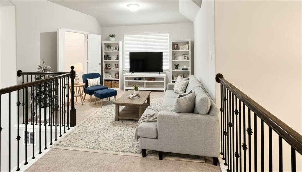 Virtually Staged -Vaulted ceiling, neutral wall color, and decorative iron stair railing featuring dark wood-finish handrails