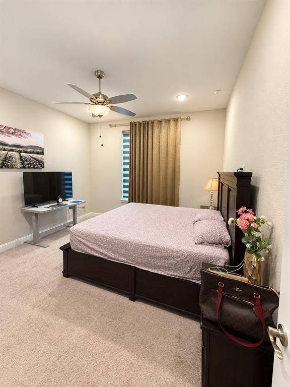 10755 Wells Branch Road, Frisco, TX 75035 Carpeted flooring throughout, featuring a ceiling fan with integrated lighting, recessed lighting, and window treatments