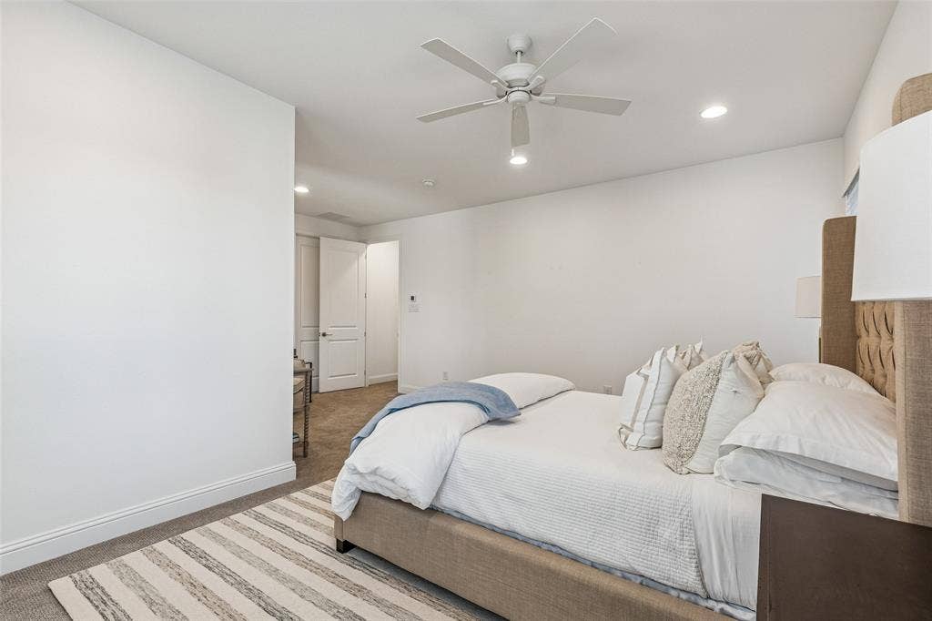 Recessed lighting, ceiling fan, carpeting, and white walls