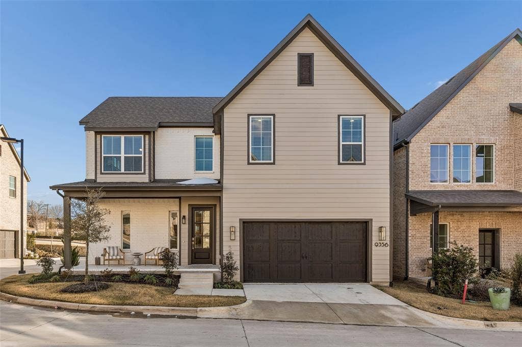 Contemporary exterior featuring a covered front porch, a two-car garage, and a combination of brick and horizontal siding