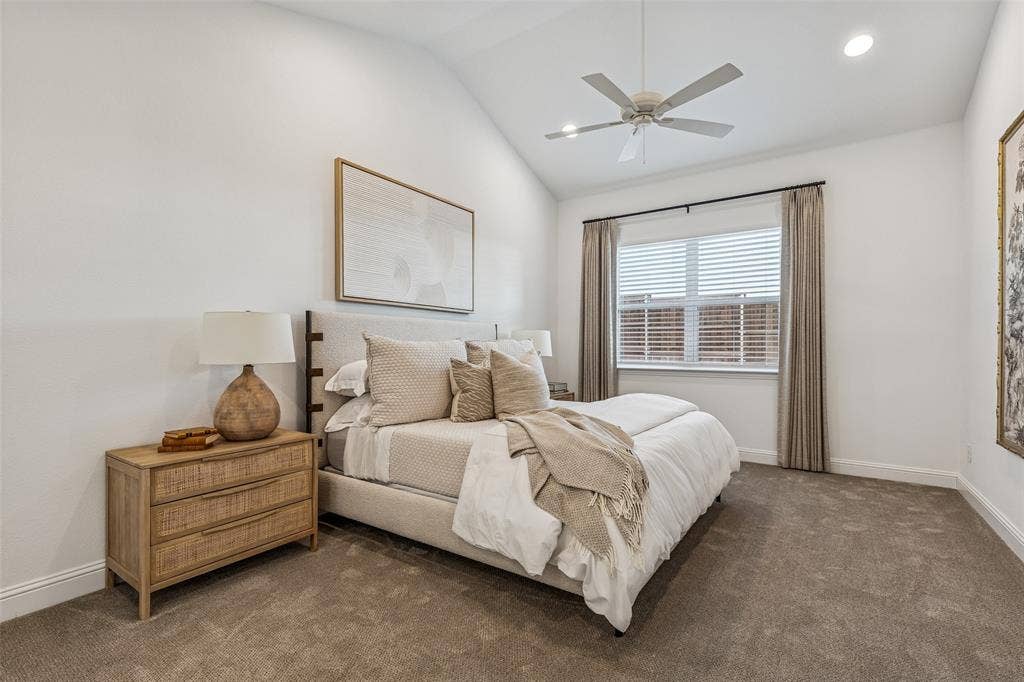 Vaulted ceiling with a ceiling fan, recessed lighting, window with blinds, and neutral carpeting