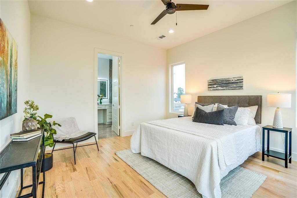 1612 Bennett Avenue, #105, Dallas, TX 75206 Spacious bedroom with light wood-finish flooring, a vaulted ceiling, and recessed lighting