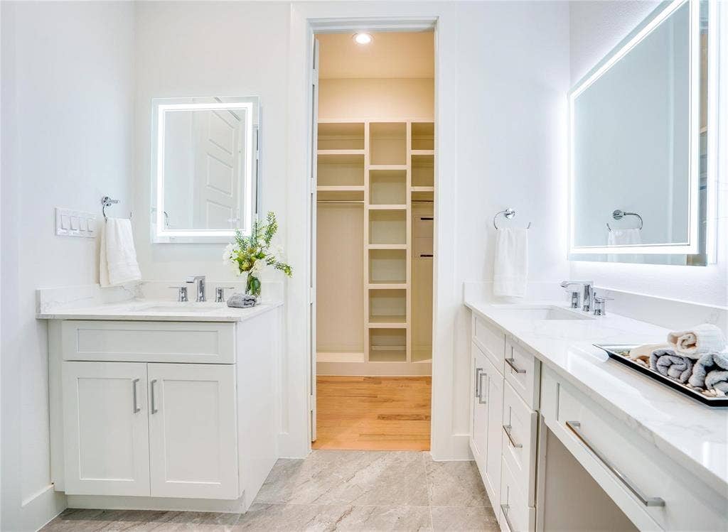 1612 Bennett Avenue, #105, Dallas, TX 75206 Dual vanity bathroom with light-toned tile flooring
