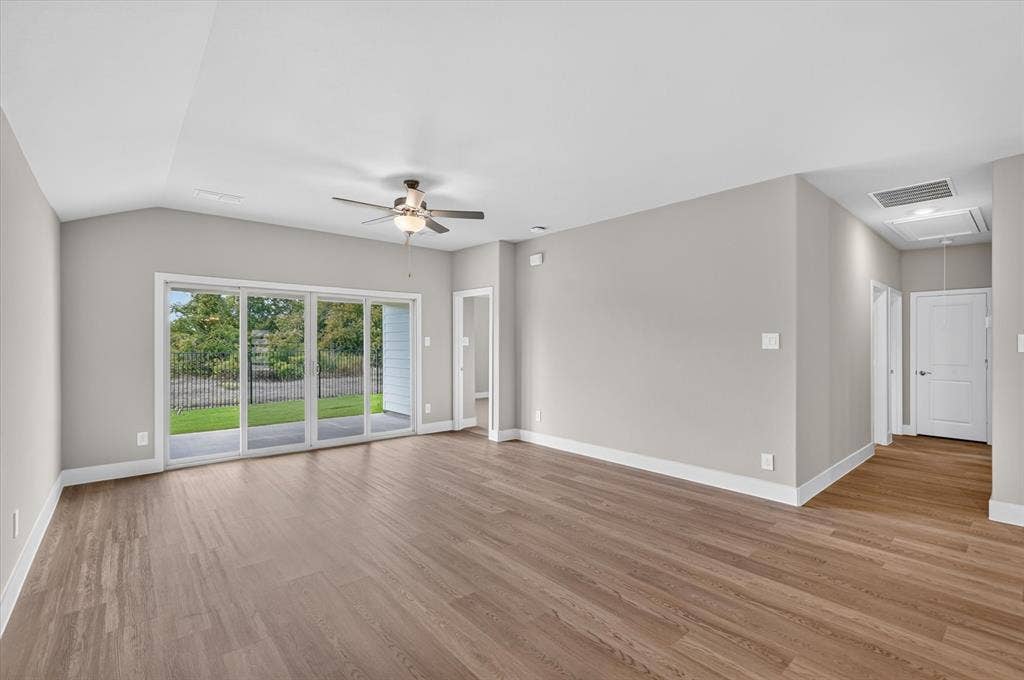 6108 Chickney Drive, Princeton, TX 75071 Vaulted ceilings, wood-finish flooring, sliding glass door, and a ceiling fan with integrated lighting
