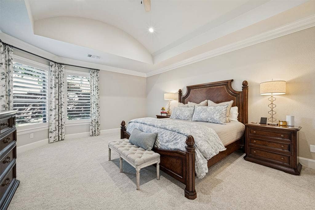 6168 Sweeney Trail, Frisco, TX 75034 Tray ceiling with recessed lighting, crown molding, double windows with plantation shutters, and light-colored carpeting