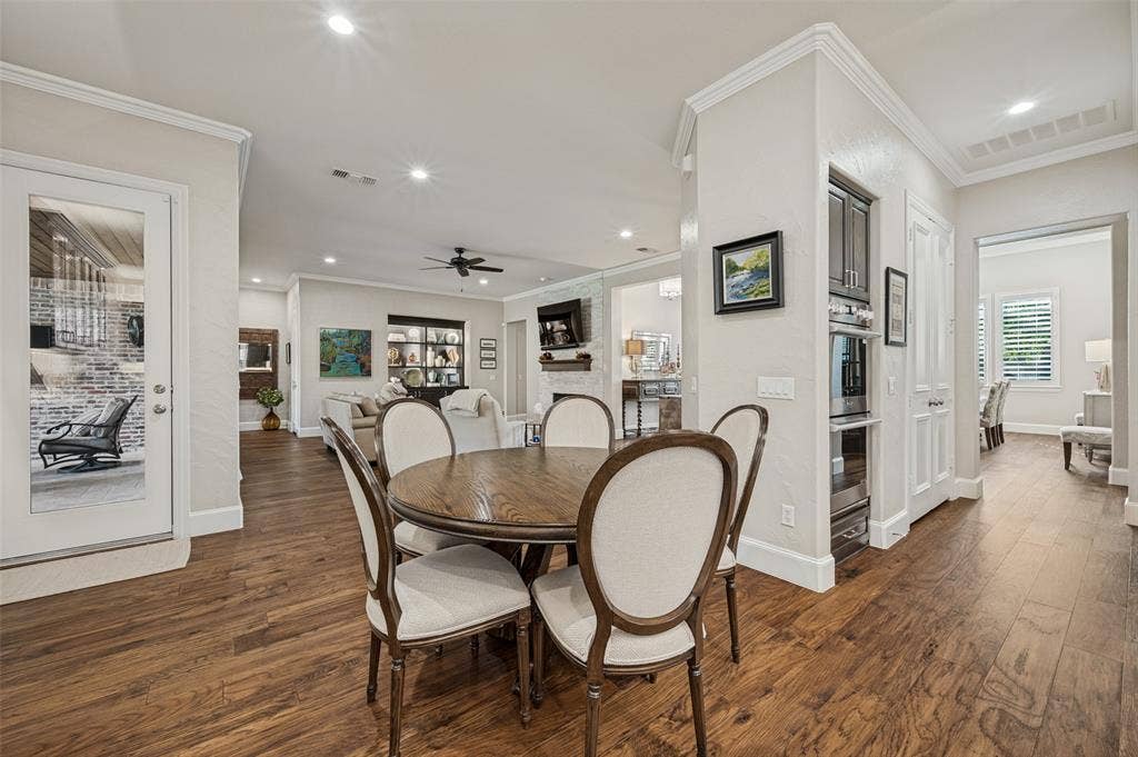6168 Sweeney Trail, Frisco, TX 75034 Wood-finish flooring throughout, recessed lighting, crown molding, built-in oven, and built-in microwave