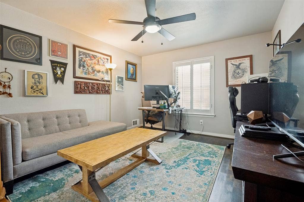 9421 Meadowknoll Drive, Dallas, TX 75243 Interior room featuring wood-finish flooring and light gray wall paint