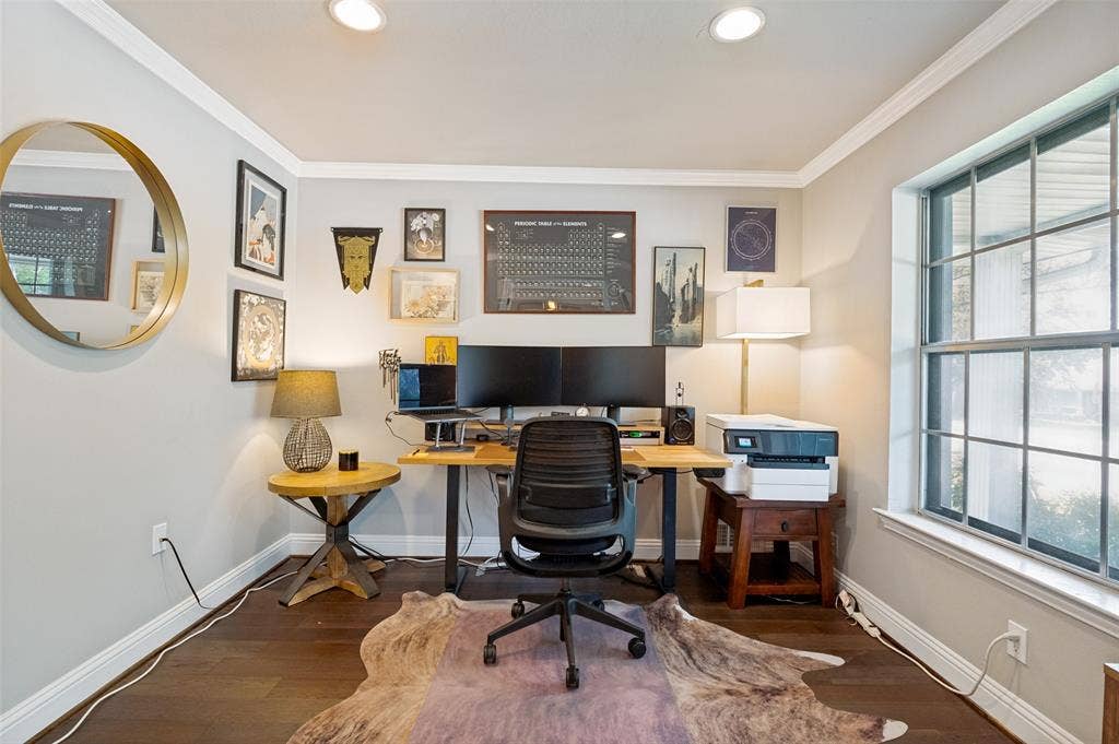 9421 Meadowknoll Drive, Dallas, TX 75243 Dedicated office space featuring rich wood-finish flooring and light gray walls
