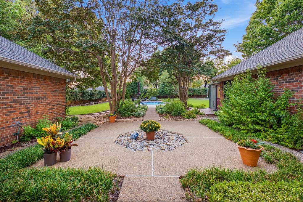 Private courtyard with river-rock accents, mature landscaping and room to unwind.