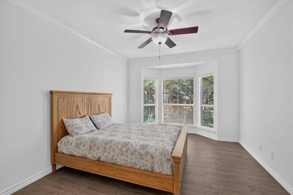 12660 Hillcrest Road, #5204, Dallas, TX 75230 Bay window with multiple panes, wood-finish flooring, ceiling fan, and crown molding
