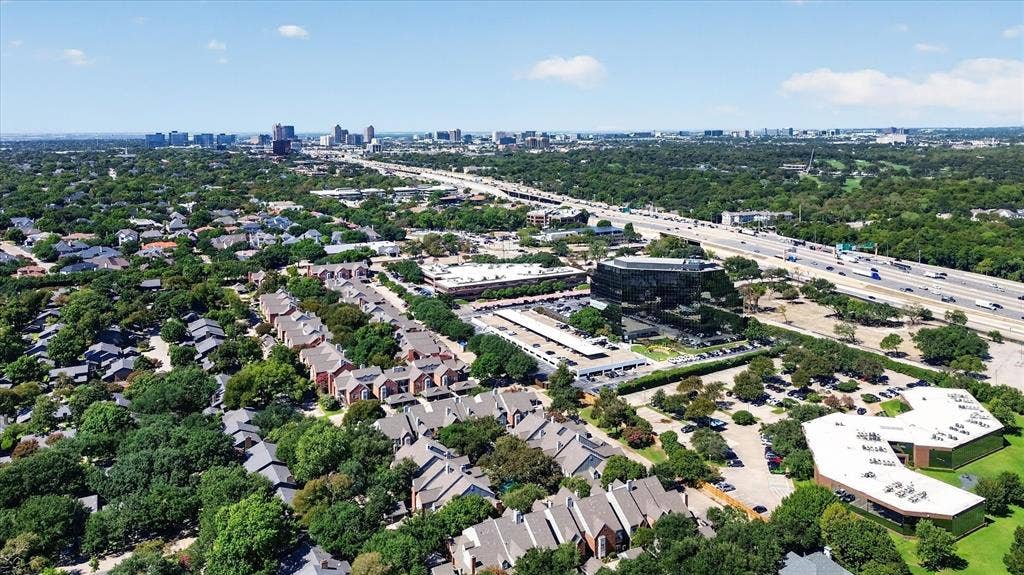 12660 Hillcrest Road, #5204, Dallas, TX 75230 Expansive urban landscape featuring a cityscape, highway infrastructure, and various commercial structures