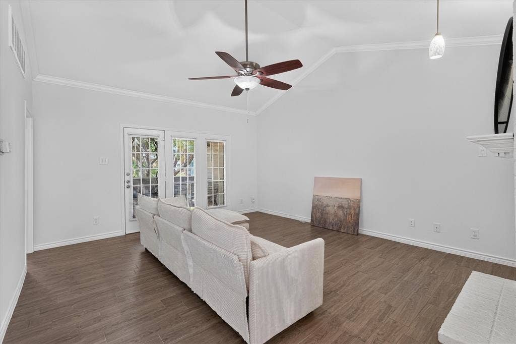 12660 Hillcrest Road, #5204, Dallas, TX 75230 Vaulted ceiling with crown molding, wood-finish flooring, ceiling fan, and two French doors