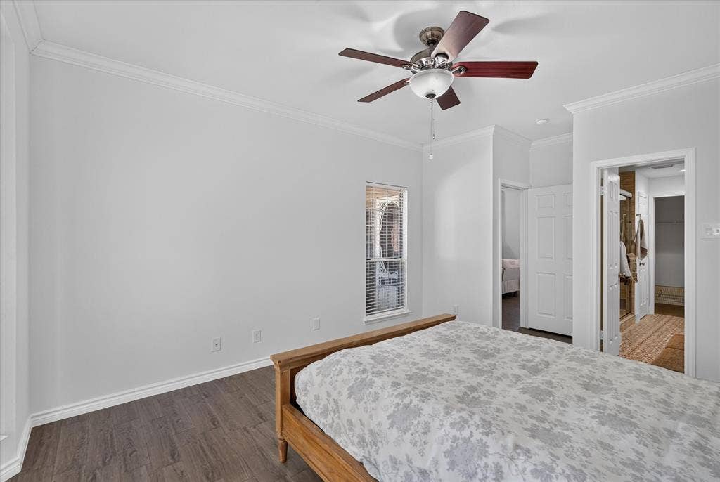 12660 Hillcrest Road, #5204, Dallas, TX 75230 Crown molding, wood-finish flooring, ceiling fan with integrated lighting, and window with blinds