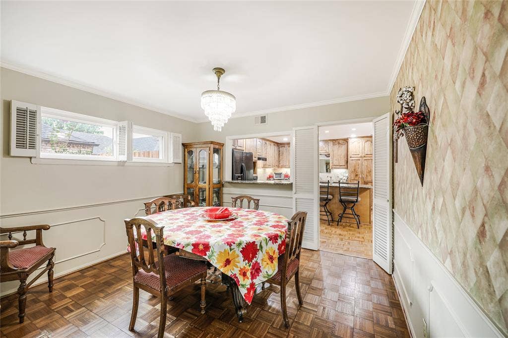 Easy access with a serving window from kitchen to the formal dining room and views of the spacious kitchen!  Ideal for entertaining!