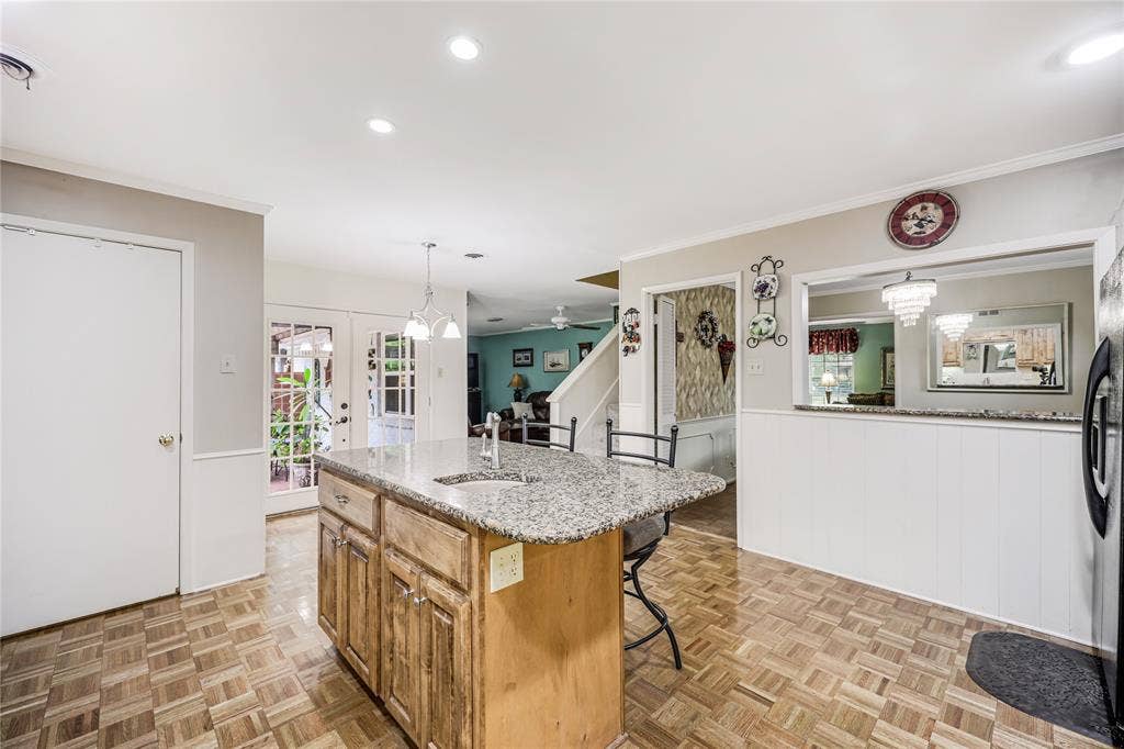 French doors open to exterior covered patio and views that open to the family room and formal dining!