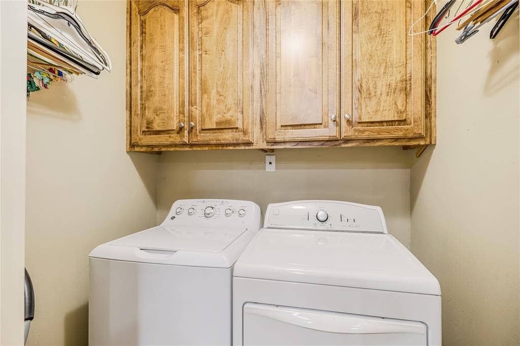 Laundry room with built in cabinets and accomodates full size washer and dryer is adjacent to the kitchen area!