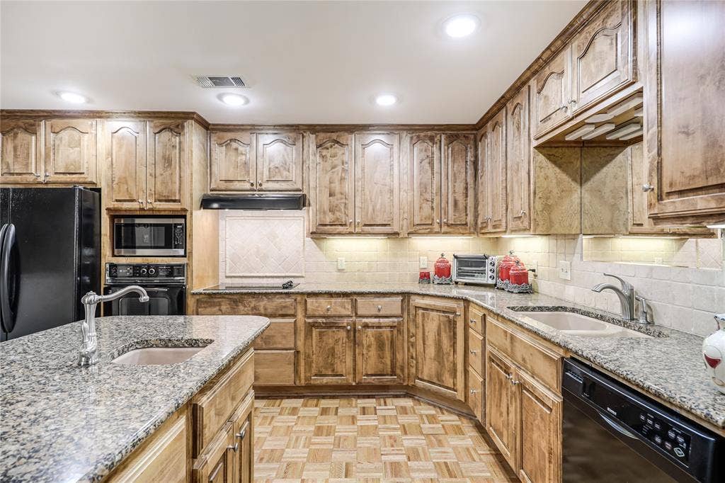 In the heart of this home and ideal for serving family and friends easy to move around in and serve two living areas, a breakfast area and outdoor patio for grilling and enjoyment as well! This lovely kitchen has been the heart of this home for the owners who have lived here for many decades to be able to serve their love of  family and their friends.