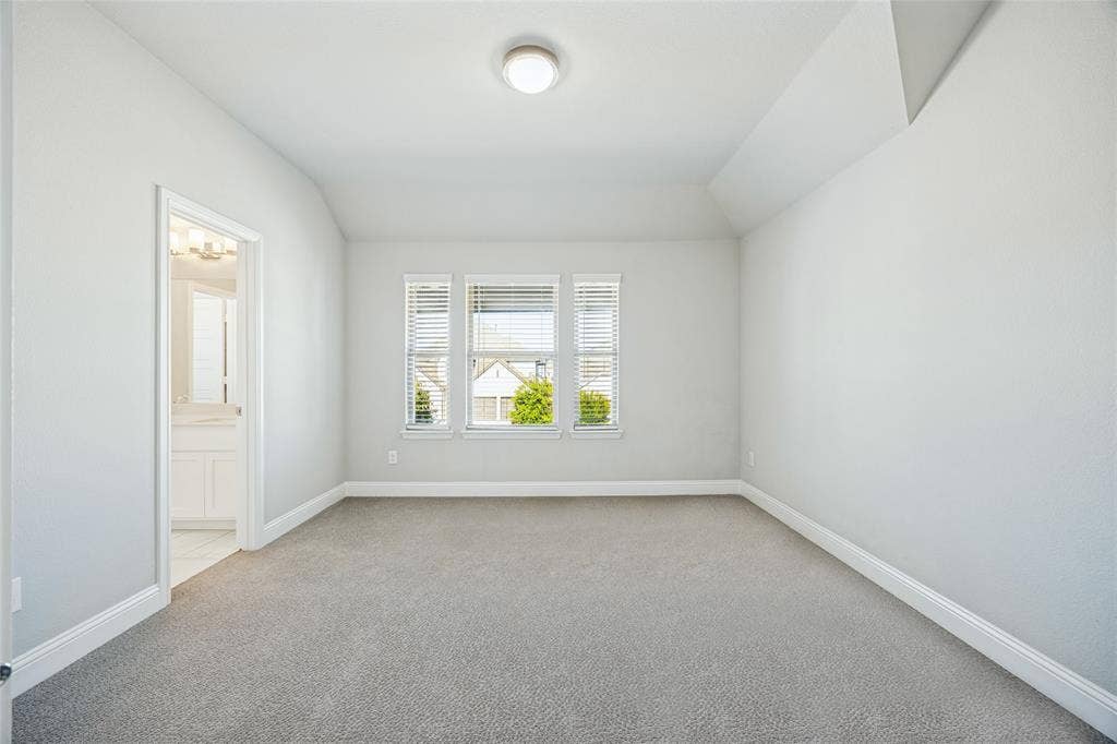 Light gray carpet flooring and white painted walls