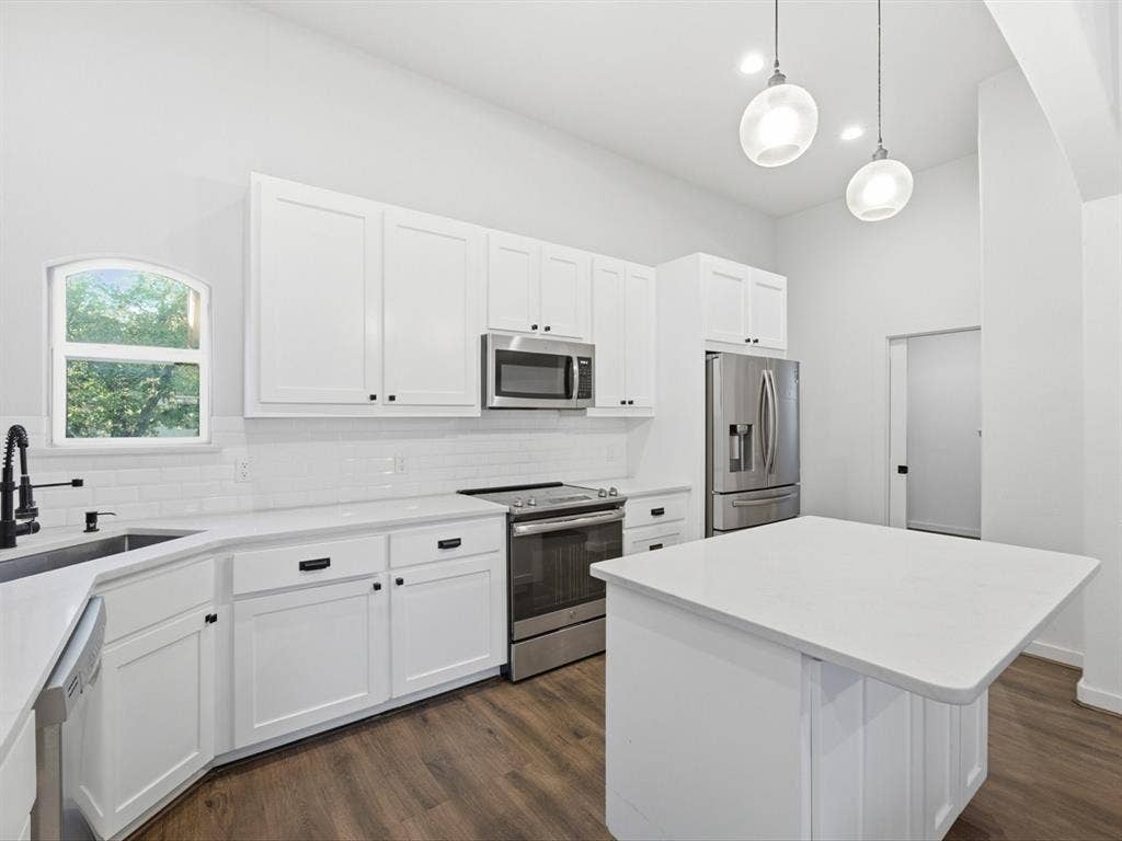 you can see the laundry room door from this view- it is not a garage passthrough but its own seperate space