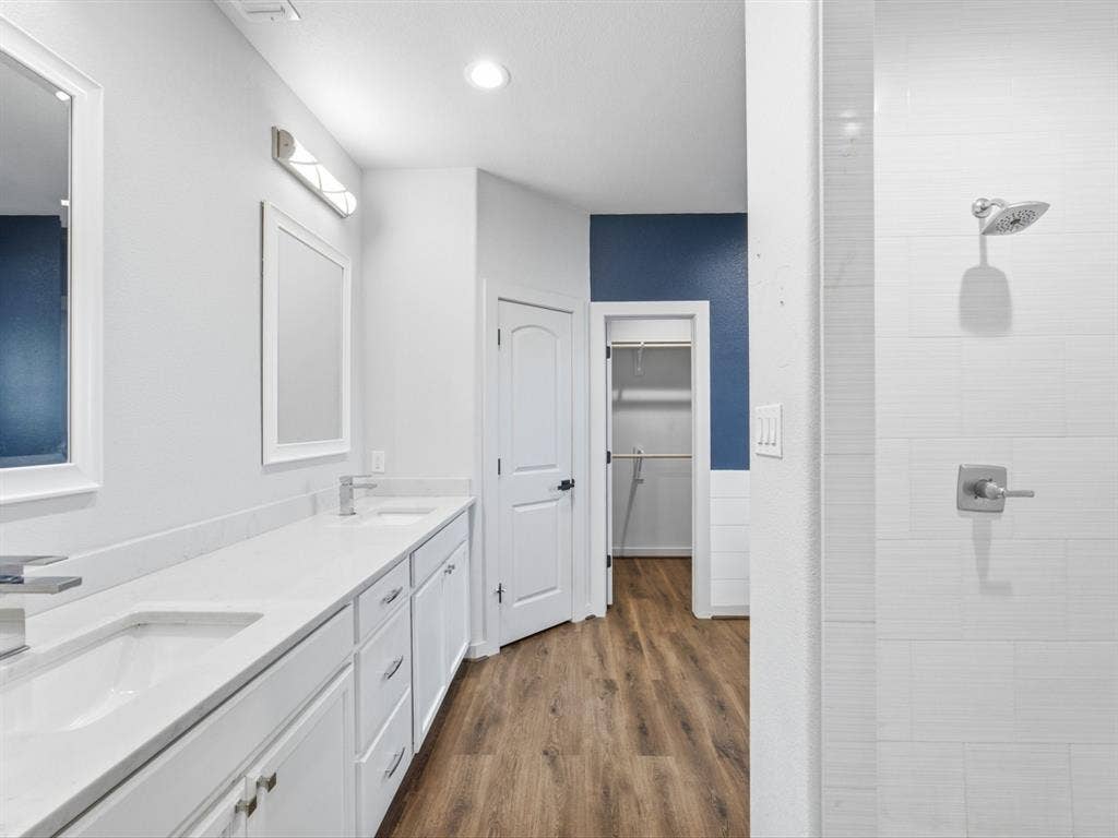 double sinks, separate shower and tub and a water closet