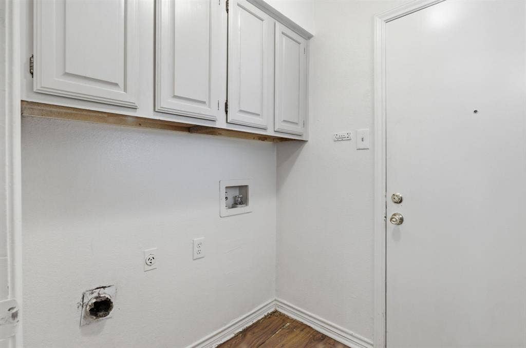 White shaker-style upper cabinetry with brushed nickel hardware