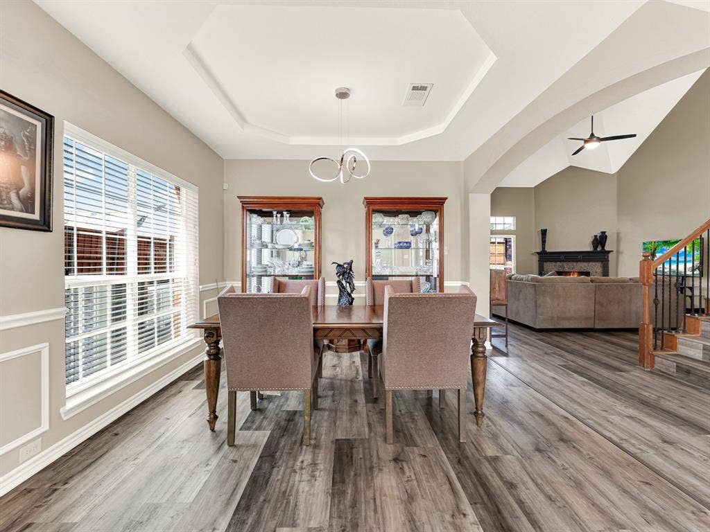 An octagonal tray ceiling gives the dining room its own architectural identity, while a broad side window brings daylight to the gathering space. Make Sunday lunch a tradition, with time for another helping and one more story.