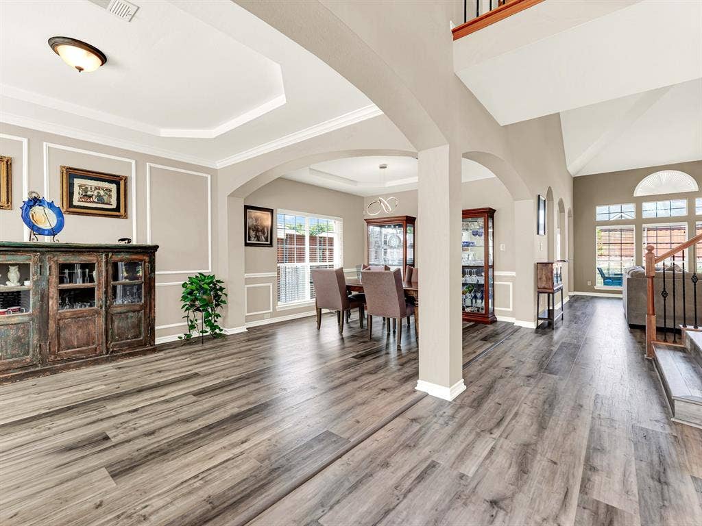 Graceful arches frame the dining area and lead the eye toward the sunlit living room, creating an inviting flow through the home. Celebrate a special occasion over dinner, then keep the evening going with dessert and conversation nearby.