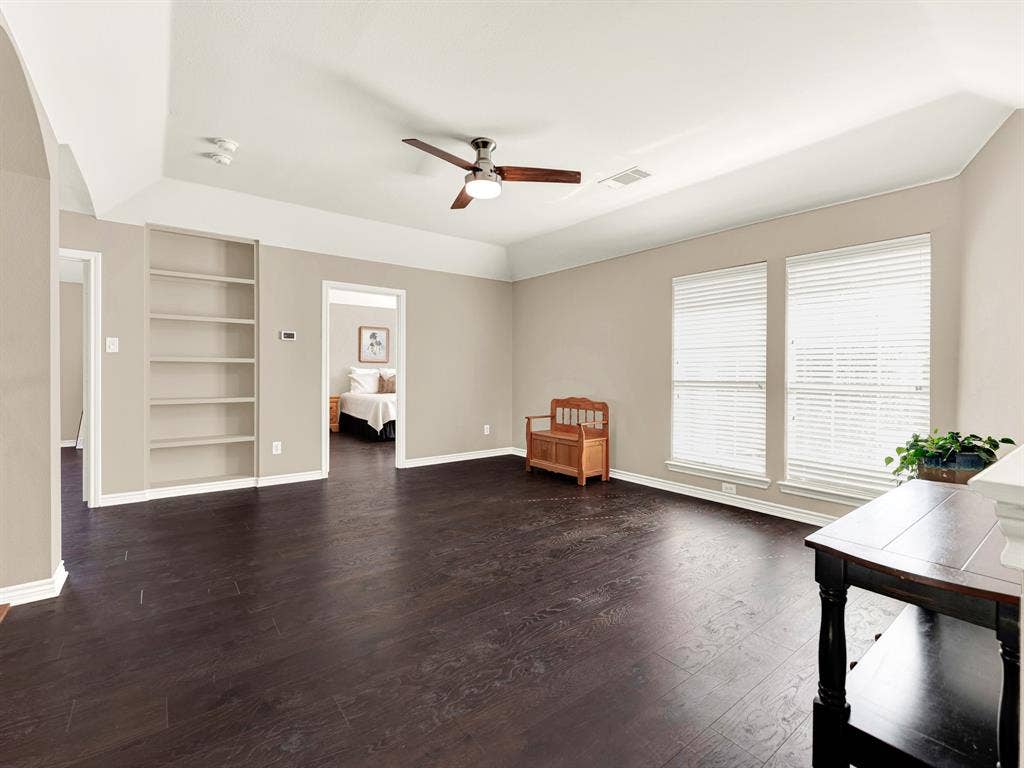 Recessed shelving adds useful depth to the game room wall, keeping storage tucked neatly beyond the main floor area. Choose a favorite game from the shelves and invite everyone to join an impromptu tournament.