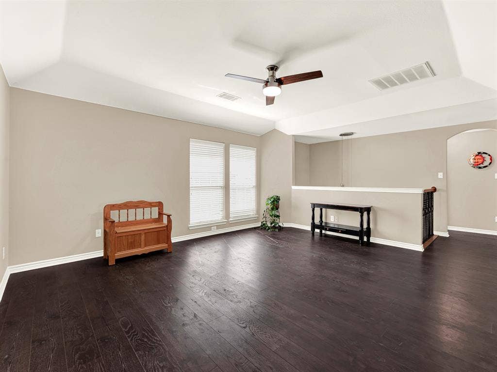 Paired windows brighten the game room’s expansive floor, while a half wall defines the space without closing it off. Spread out a favorite board game and let a rainy afternoon turn into hours of laughter.
