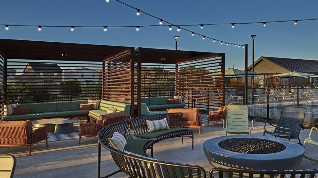 View of patio / terrace with an outdoor living space with a fire pit