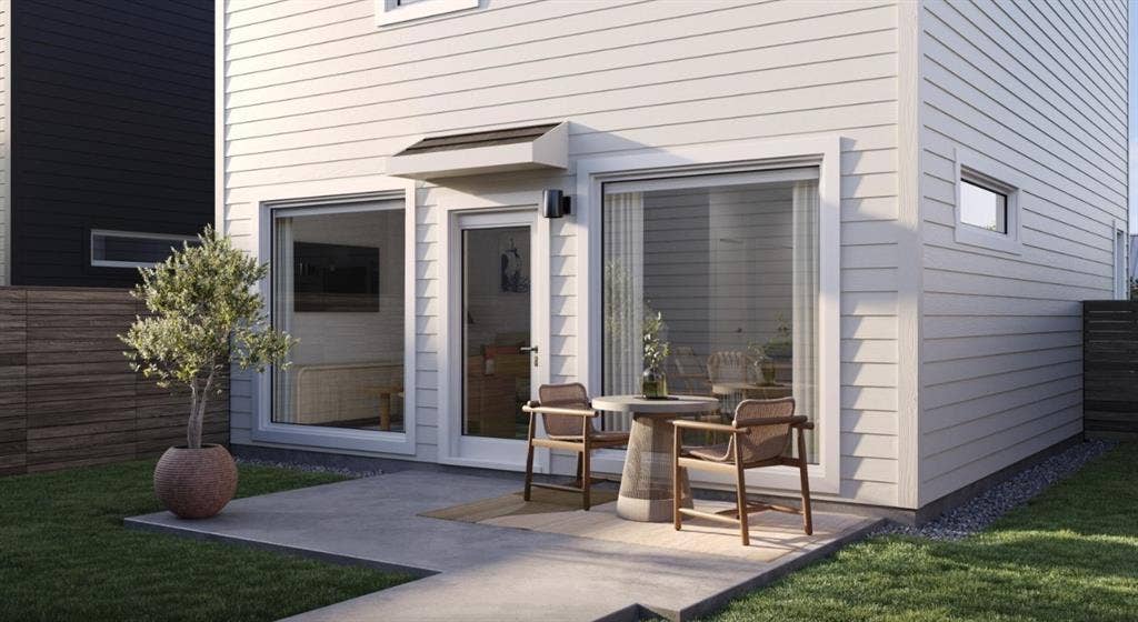 Property entrance featuring a patio area and a lawn