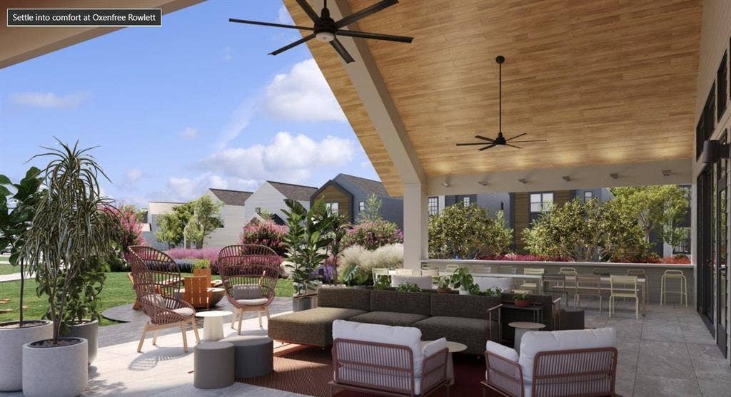 View of patio with an outdoor hangout area and ceiling fan