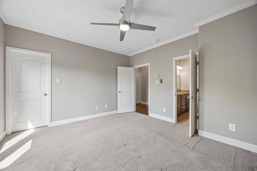 Crown molding and a ceiling fan with integrated lighting