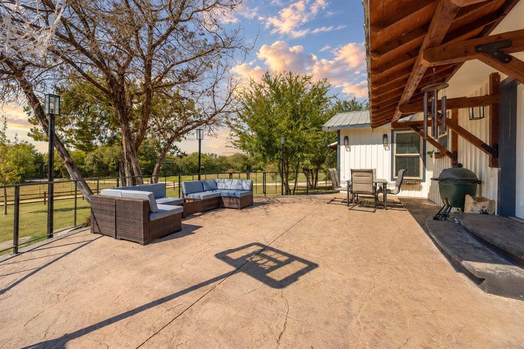 384 Fort Graham Road, Waco, TX 76705 Stamped concrete patio with integrated lighting and a metal railing