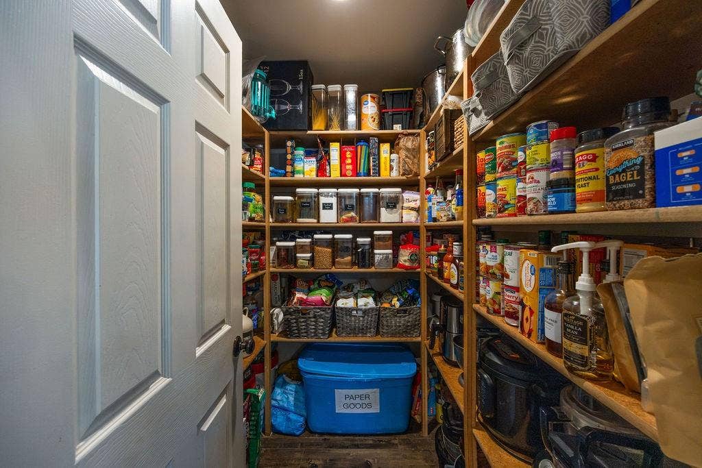384 Fort Graham Road, Waco, TX 76705 Walk-in pantry featuring extensive wood shelving, recessed lighting, and a paneled interior door